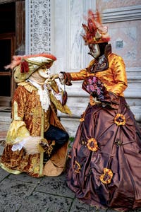 The parade of people in costume at the 2026 Venice Carnival in front of the Church of San Zaccaria.