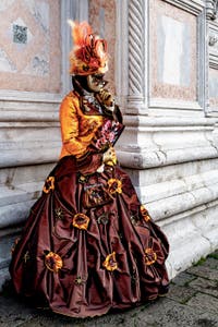 The parade of people in costume at the 2026 Venice Carnival in front of the Church of San Zaccaria.