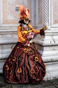 The parade of people in costume at the 2026 Venice Carnival in front of the Church of San Zaccaria.