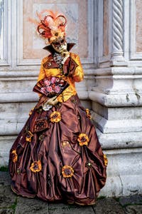 The parade of people in costume at the 2026 Venice Carnival in front of the Church of San Zaccaria.