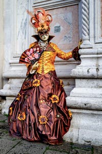 The parade of people in costume at the 2026 Venice Carnival in front of the Church of San Zaccaria.
