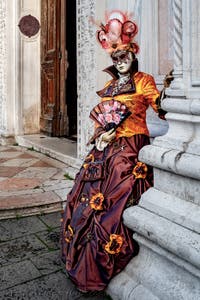 The parade of people in costume at the 2026 Venice Carnival in front of the Church of San Zaccaria.