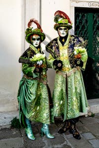 The parade of people in costume at the 2026 Venice Carnival in front of the Church of San Zaccaria.