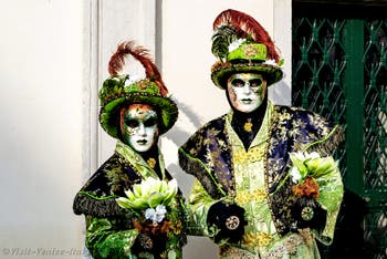 The parade of people in costume at the 2026 Venice Carnival in front of the Church of San Zaccaria.