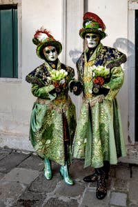 The parade of people in costume at the 2026 Venice Carnival in front of the Church of San Zaccaria.