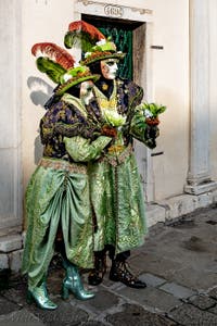 The parade of people in costume at the 2026 Venice Carnival in front of the Church of San Zaccaria.