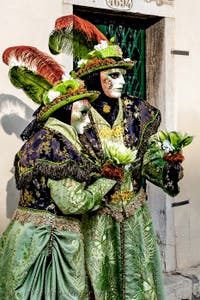 The parade of people in costume at the 2026 Venice Carnival in front of the Church of San Zaccaria.