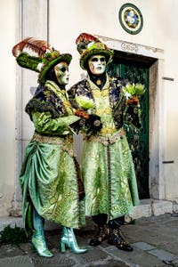 The parade of people in costume at the 2026 Venice Carnival in front of the Church of San Zaccaria.