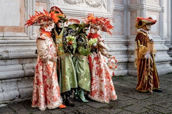 The parade of people in costume at the 2026 Venice Carnival in front of the Church of San Zaccaria.