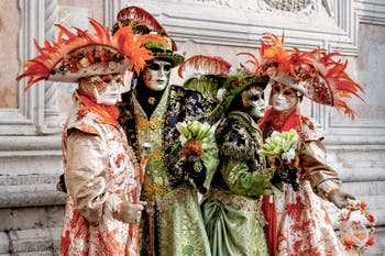The parade of people in costume at the 2026 Venice Carnival in front of the Church of San Zaccaria.