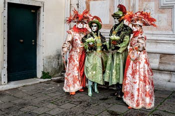 The parade of people in costume at the 2026 Venice Carnival in front of the Church of San Zaccaria.