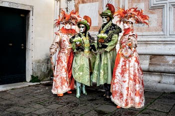 The parade of people in costume at the 2026 Venice Carnival in front of the Church of San Zaccaria.