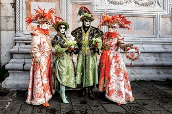 The parade of people in costume at the 2026 Venice Carnival in front of the Church of San Zaccaria.