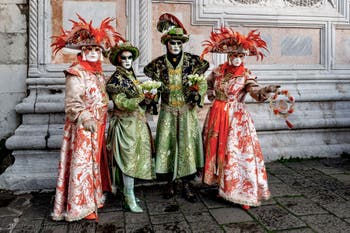 The parade of people in costume at the 2026 Venice Carnival in front of the Church of San Zaccaria.