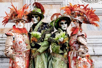 Venice carnival costumed figures