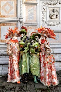 The parade of people in costume at the 2026 Venice Carnival in front of the Church of San Zaccaria.