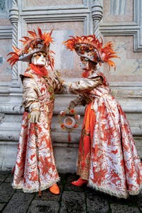 The parade of people in costume at the 2026 Venice Carnival in front of the Church of San Zaccaria.