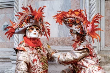 The parade of people in costume at the 2026 Venice Carnival in front of the Church of San Zaccaria.