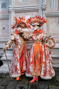 The parade of people in costume at the 2026 Venice Carnival in front of the Church of San Zaccaria.