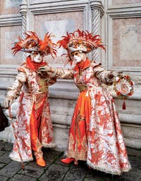 The parade of people in costume at the 2026 Venice Carnival in front of the Church of San Zaccaria.
