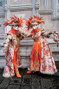 The parade of people in costume at the 2026 Venice Carnival in front of the Church of San Zaccaria.