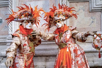 The parade of people in costume at the 2026 Venice Carnival in front of the Church of San Zaccaria.