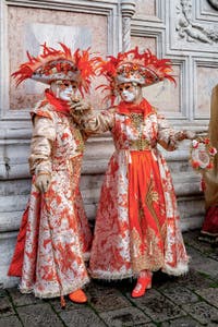The parade of people in costume at the 2026 Venice Carnival in front of the Church of San Zaccaria.