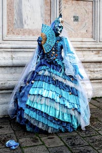 The parade of people in costume at the 2026 Venice Carnival in front of the Church of San Zaccaria.