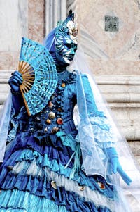 The parade of people in costume at the 2026 Venice Carnival in front of the Church of San Zaccaria.