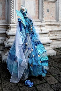 The parade of people in costume at the 2026 Venice Carnival in front of the Church of San Zaccaria.