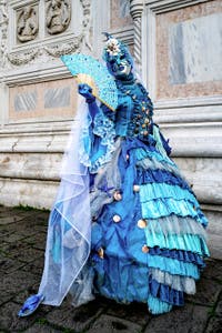 The parade of people in costume at the 2026 Venice Carnival in front of the Church of San Zaccaria.