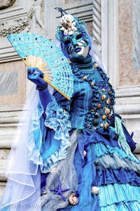 The parade of people in costume at the 2026 Venice Carnival in front of the Church of San Zaccaria.