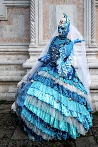 The parade of people in costume at the 2026 Venice Carnival in front of the Church of San Zaccaria.
