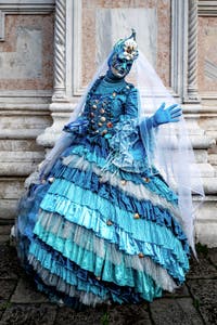 The parade of people in costume at the 2026 Venice Carnival in front of the Church of San Zaccaria.