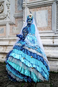 The parade of people in costume at the 2026 Venice Carnival in front of the Church of San Zaccaria.