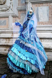 The parade of people in costume at the 2026 Venice Carnival in front of the Church of San Zaccaria.