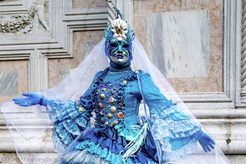 Venice carnival costumed figures