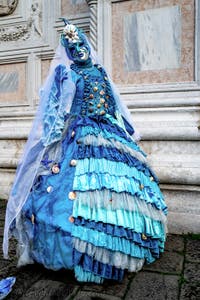 The parade of people in costume at the 2026 Venice Carnival in front of the Church of San Zaccaria.