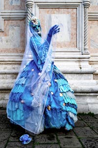 The parade of people in costume at the 2026 Venice Carnival in front of the Church of San Zaccaria.