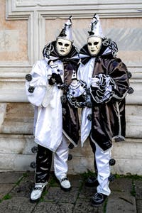The parade of people in costume at the 2026 Venice Carnival in front of the Church of San Zaccaria.