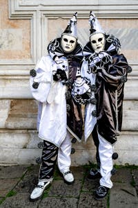 The parade of people in costume at the 2026 Venice Carnival in front of the Church of San Zaccaria.