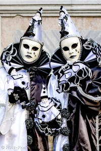 The parade of people in costume at the 2026 Venice Carnival in front of the Church of San Zaccaria.