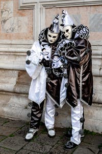 The parade of people in costume at the 2026 Venice Carnival in front of the Church of San Zaccaria.