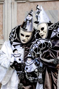 The parade of people in costume at the 2026 Venice Carnival in front of the Church of San Zaccaria.