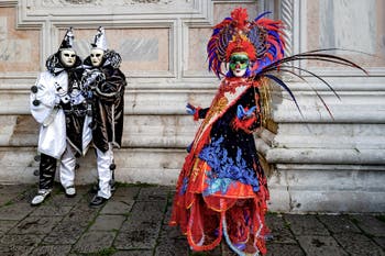 The parade of people in costume at the 2026 Venice Carnival in front of the Church of San Zaccaria.