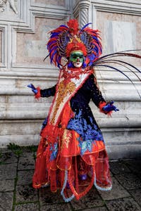 The parade of people in costume at the 2026 Venice Carnival in front of the Church of San Zaccaria.