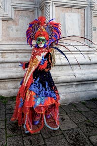 The parade of people in costume at the 2026 Venice Carnival in front of the Church of San Zaccaria.