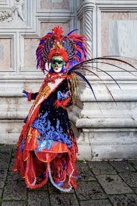 The parade of people in costume at the 2026 Venice Carnival in front of the Church of San Zaccaria.