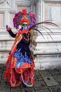 The parade of people in costume at the 2026 Venice Carnival in front of the Church of San Zaccaria.