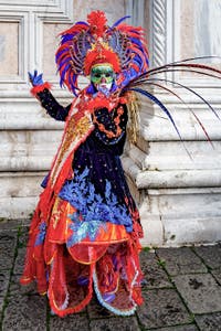 The parade of people in costume at the 2026 Venice Carnival in front of the Church of San Zaccaria.